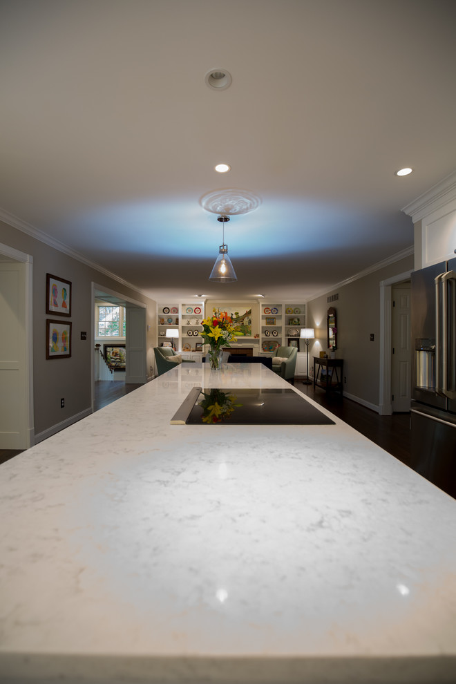 Example of a large transitional medium tone wood floor home design design with a farmhouse sink and stainless steel appliances