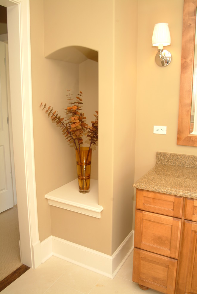 Bathroom - mid-sized transitional 3/4 ceramic tile and beige floor bathroom idea in Chicago with recessed-panel cabinets, medium tone wood cabinets, a two-piece toilet, beige walls, a drop-in sink, laminate countertops and beige countertops