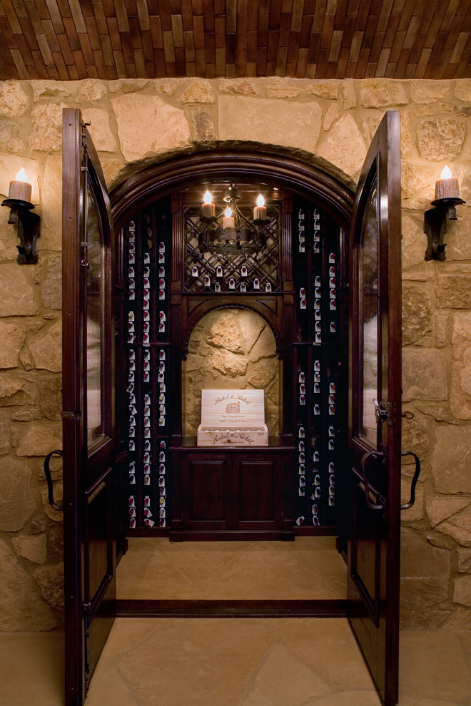Photo of a traditional wine cellar in Austin with storage racks and yellow floor.
