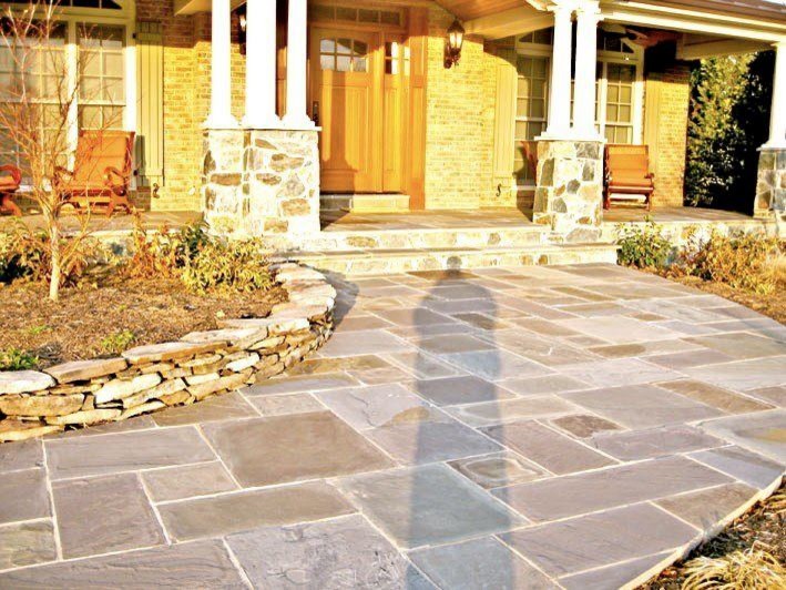 Photo of a traditional front yard garden in DC Metro with natural stone pavers and with path.