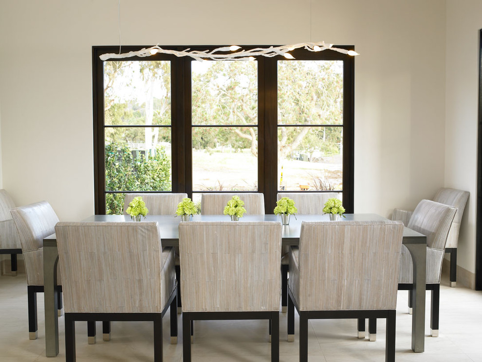 Design ideas for a mediterranean dining room in San Diego with white walls.