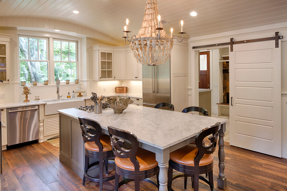 Eat-in kitchen - mid-sized cottage l-shaped dark wood floor eat-in kitchen idea in Grand Rapids with a double-bowl sink, recessed-panel cabinets, white cabinets, marble countertops, stainless steel appliances and an island