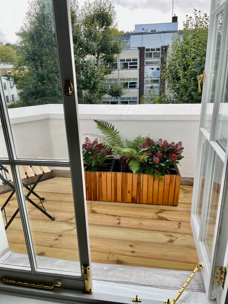 Design ideas for a small victorian apartment balcony in London.