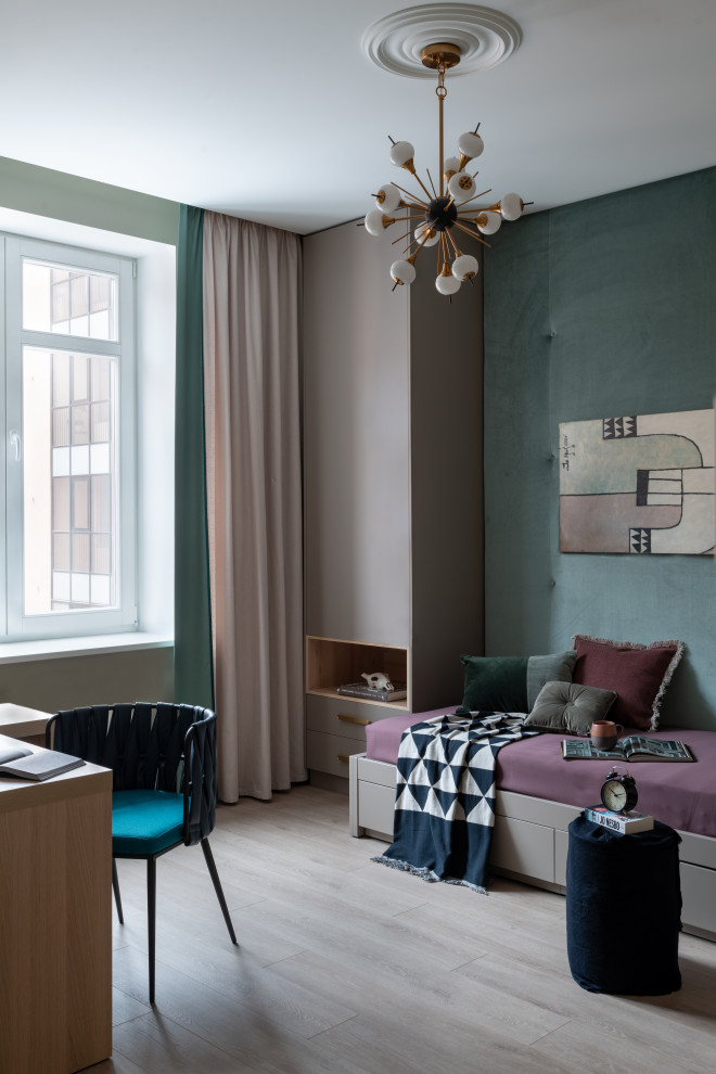 This is an example of a mid-sized contemporary gender-neutral kids' room in Saint Petersburg with laminate floors and grey floor.