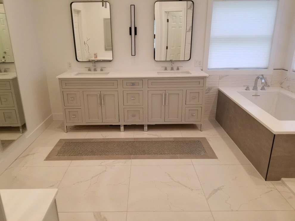 Inspiration for a mid-sized modern master bathroom in Chicago with recessed-panel cabinets, grey cabinets, an undermount tub, black and white tile, porcelain tile, porcelain floors, engineered quartz benchtops, white floor, white benchtops, a double vanity, a freestanding vanity, an open shower, an undermount sink, an open shower and an enclosed toilet.