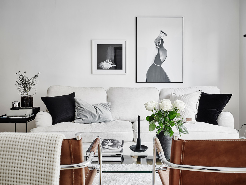 Mid-sized modern formal open concept living room in Gothenburg with white walls, no fireplace and no tv.