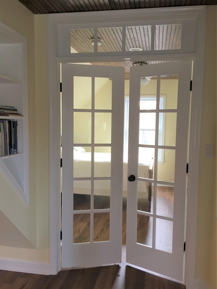Inspiration for a large timeless loft-style vinyl floor home design remodel with yellow walls