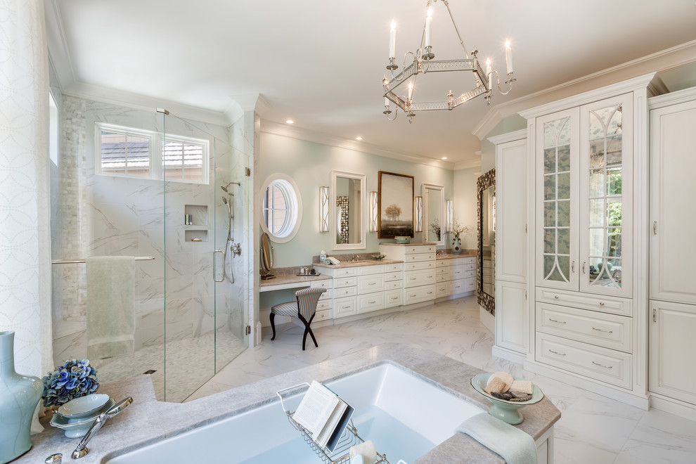 Traditional bathroom in Other with raised-panel cabinets, white cabinets, an undermount tub, a curbless shower, an undermount sink, white floor, a hinged shower door, grey benchtops, white tile, porcelain tile, porcelain floors and quartzite benchtops.