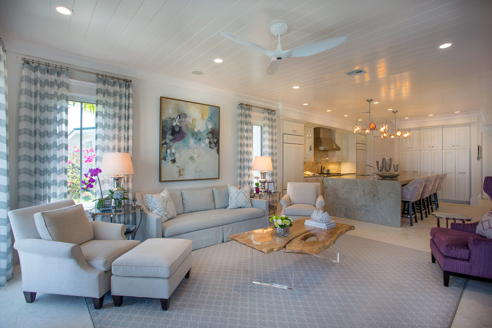 Mid-sized transitional open concept living room in Miami with white walls and travertine floors.