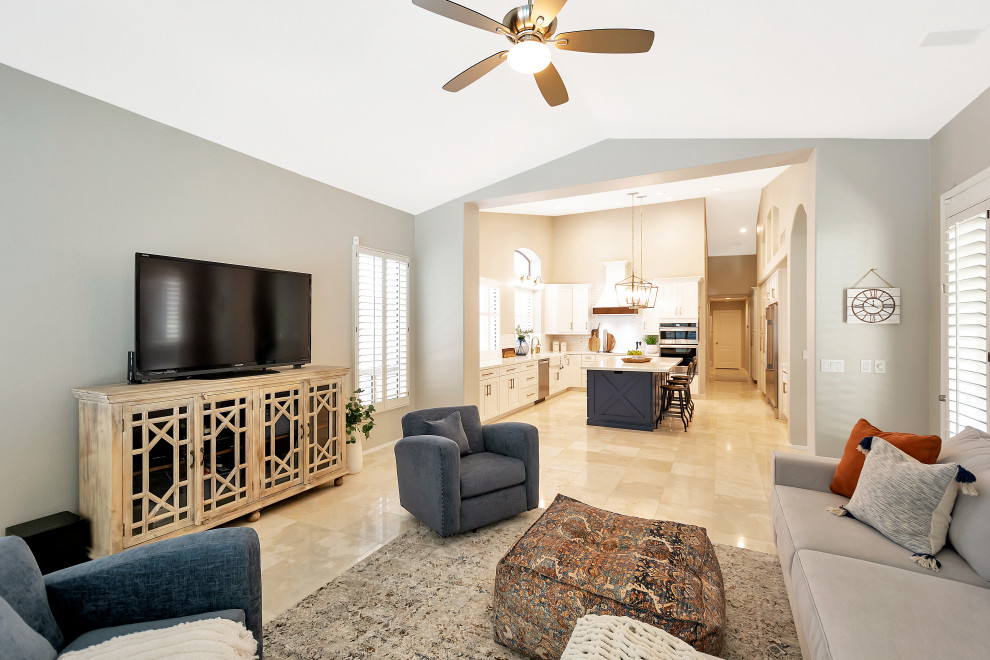 Example of a large transitional u-shaped open concept kitchen design in Phoenix with a farmhouse sink, shaker cabinets, white cabinets, quartz countertops, white backsplash, subway tile backsplash, stainless steel appliances, an island and white countertops