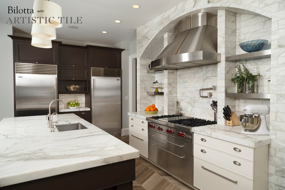 Huge u-shaped marble floor eat-in kitchen photo in New York with an undermount sink, shaker cabinets, dark wood cabinets, marble countertops, white backsplash, stainless steel appliances and an island
