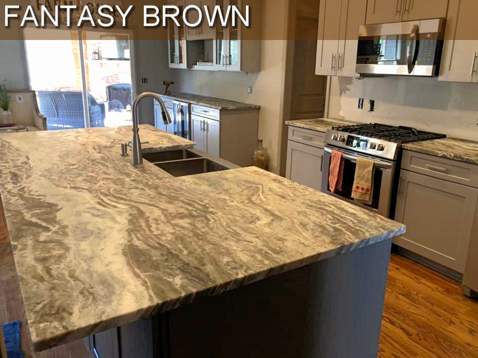 Inspiration for a large modern galley kitchen in Atlanta with marble benchtops, brown benchtop, recessed-panel cabinets, multiple islands, an undermount sink, beige cabinets, stainless steel appliances, plywood floors and brown floor.