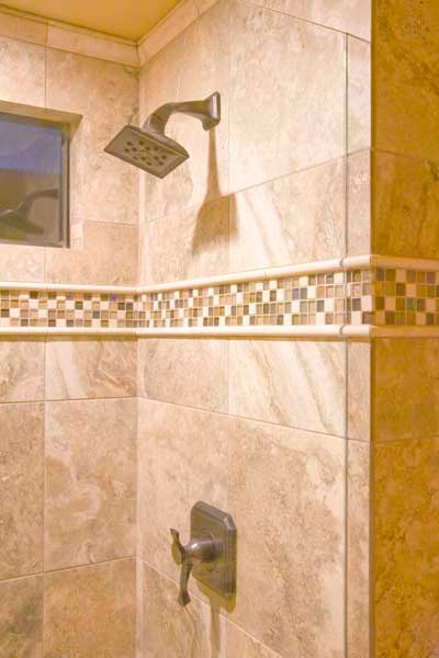 Corner shower - large transitional master corner shower idea with flat-panel cabinets, dark wood cabinets, beige walls, an undermount sink and a hinged shower door