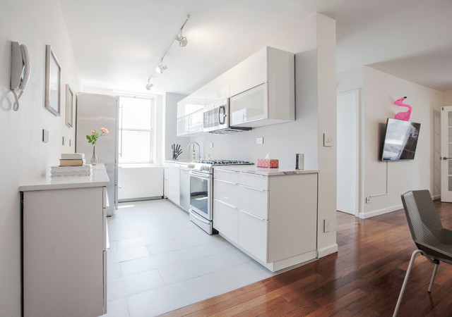 Kitchen w Ikea White Glossy Sektion Cabinets and Highend Appliances contemporary-kitchen