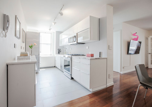 IKEA kitchen cabinets vs pre assembled cabinets in a modern white kitchen design