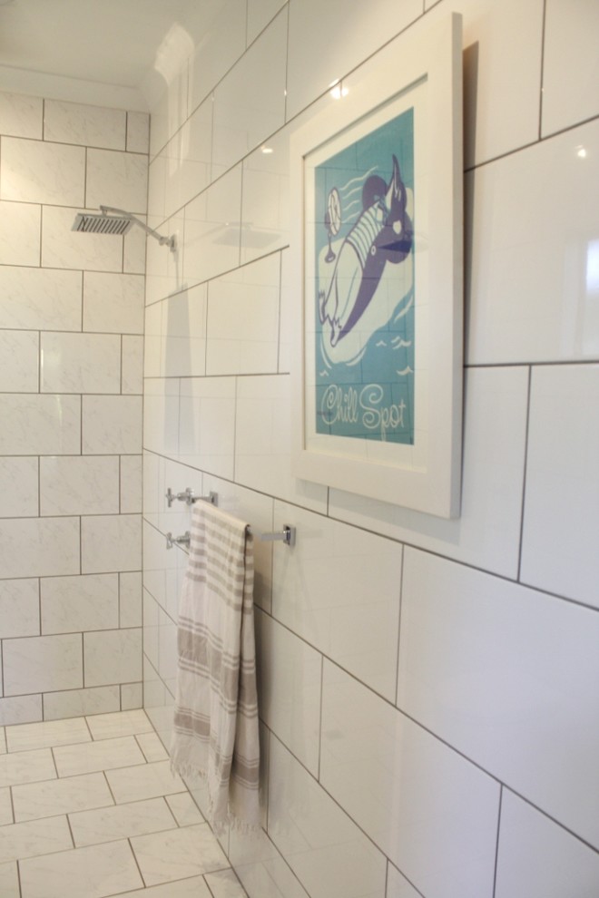 This is an example of a small contemporary bathroom in Dunedin with a vessel sink, open cabinets, light wood cabinets, wood benchtops, an open shower, a one-piece toilet, white tile, ceramic tile, white walls and marble floors.