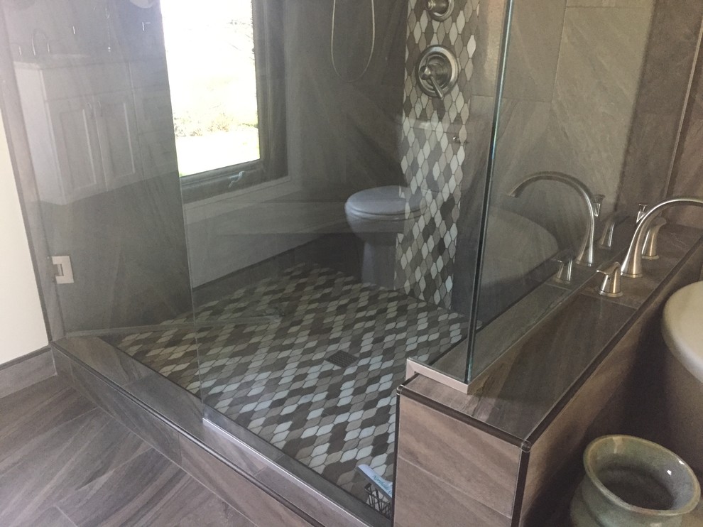 Inspiration for a medium sized traditional ensuite bathroom in Indianapolis with recessed-panel cabinets, white cabinets, a freestanding bath, a corner shower, porcelain tiles, grey walls, porcelain flooring, a submerged sink and engineered stone worktops.