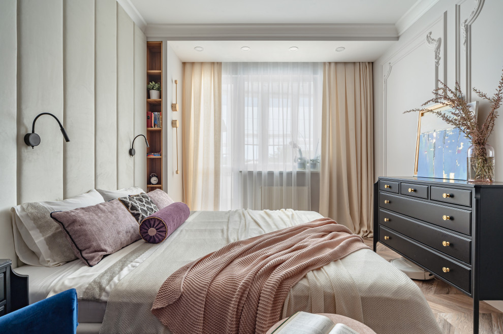 This is an example of a mid-sized transitional master bedroom in Other with beige walls, laminate floors and beige floor.