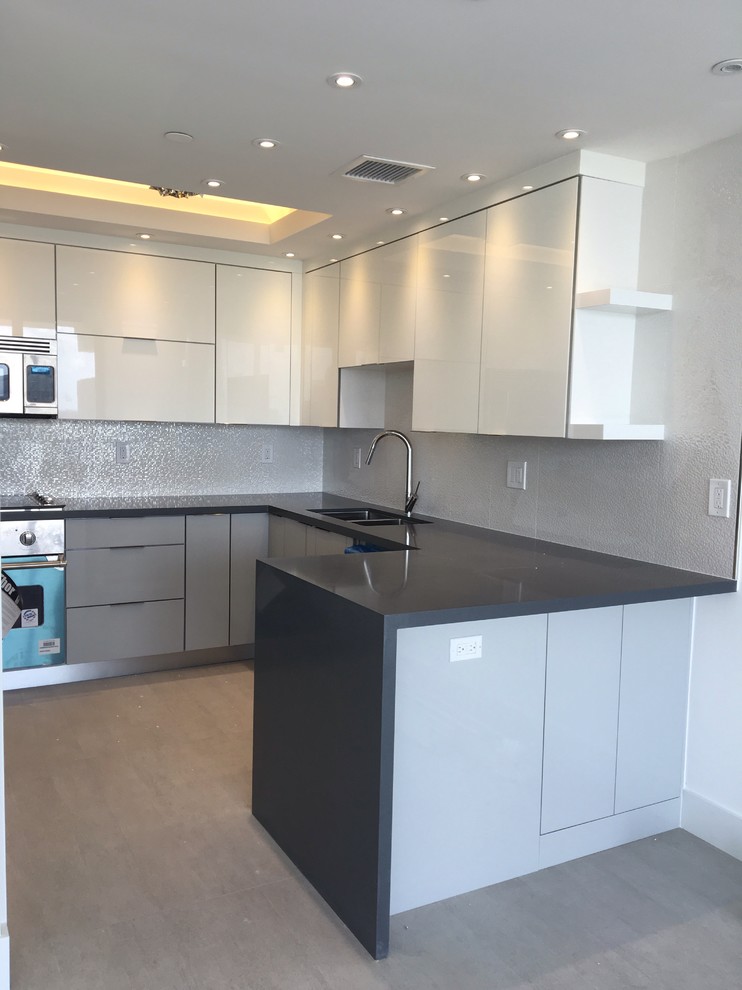 Contemporary kitchen with contrasting gray lower cabinets with white upper cabin