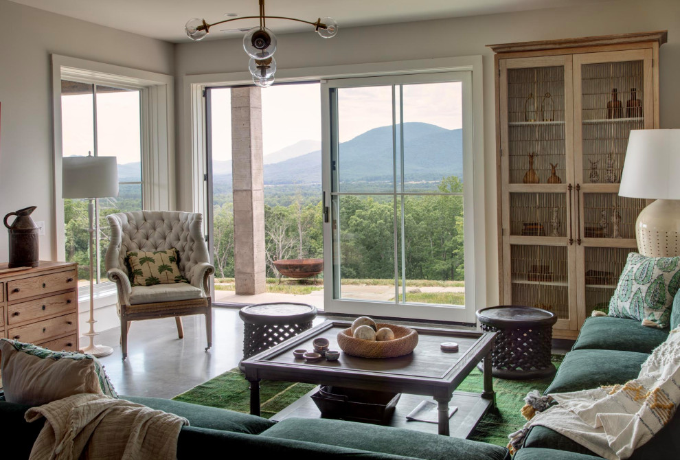 Huge transitional concrete floor and black floor great room photo in Richmond with beige walls