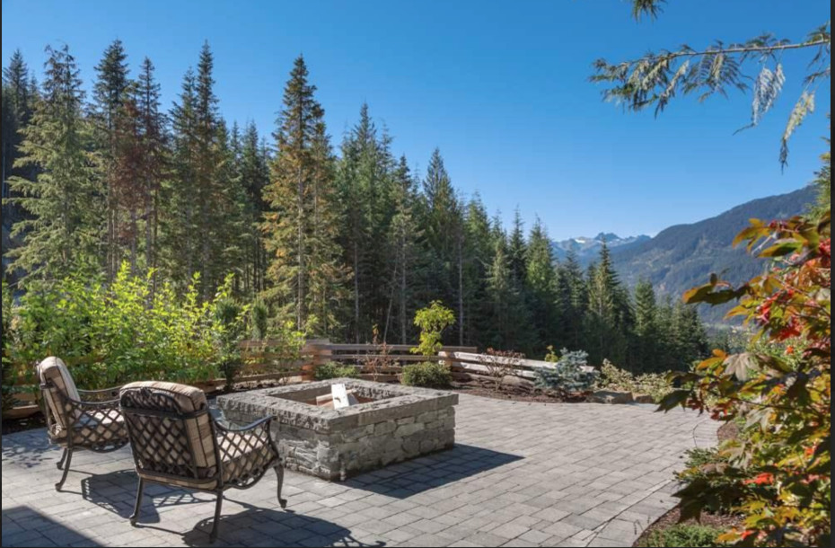 Patio - large rustic backyard concrete paver patio idea in Vancouver with a fire pit and no cover