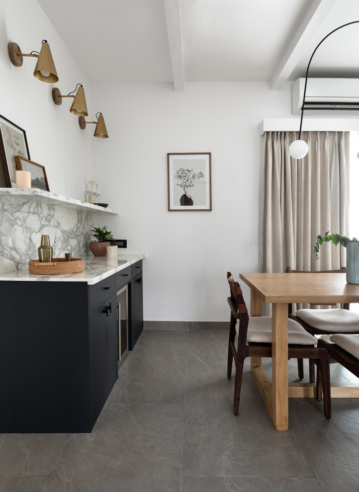 This is an example of a contemporary dining room in Chennai.