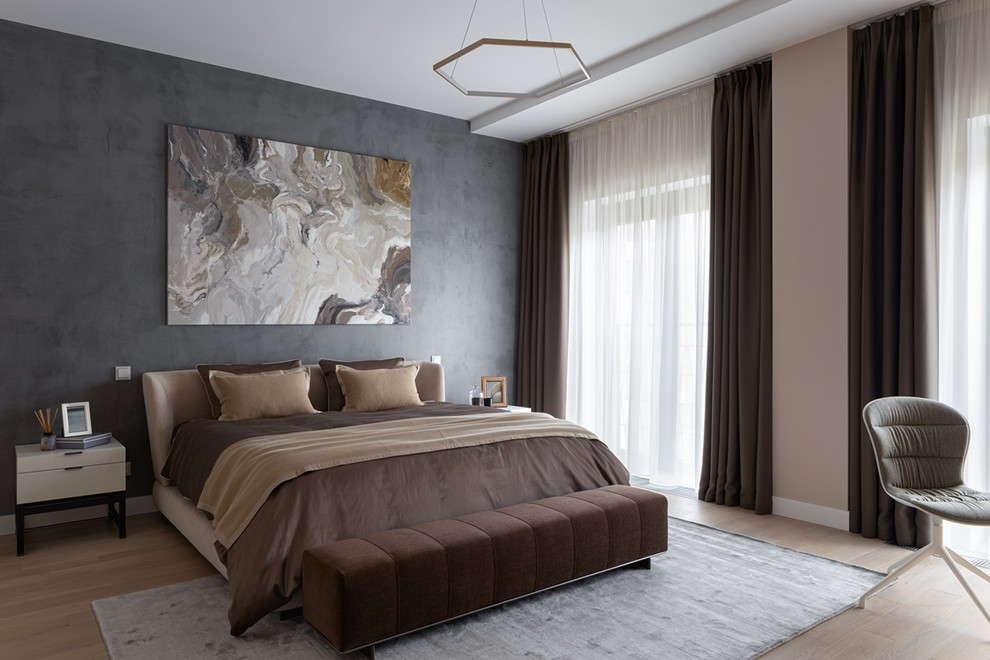 Inspiration for a large contemporary master bedroom in Moscow with beige walls, light hardwood floors, no fireplace and beige floor.