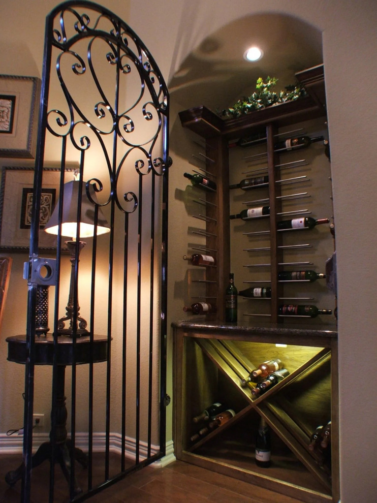Small industrial wine cellar in Phoenix with plywood floors.