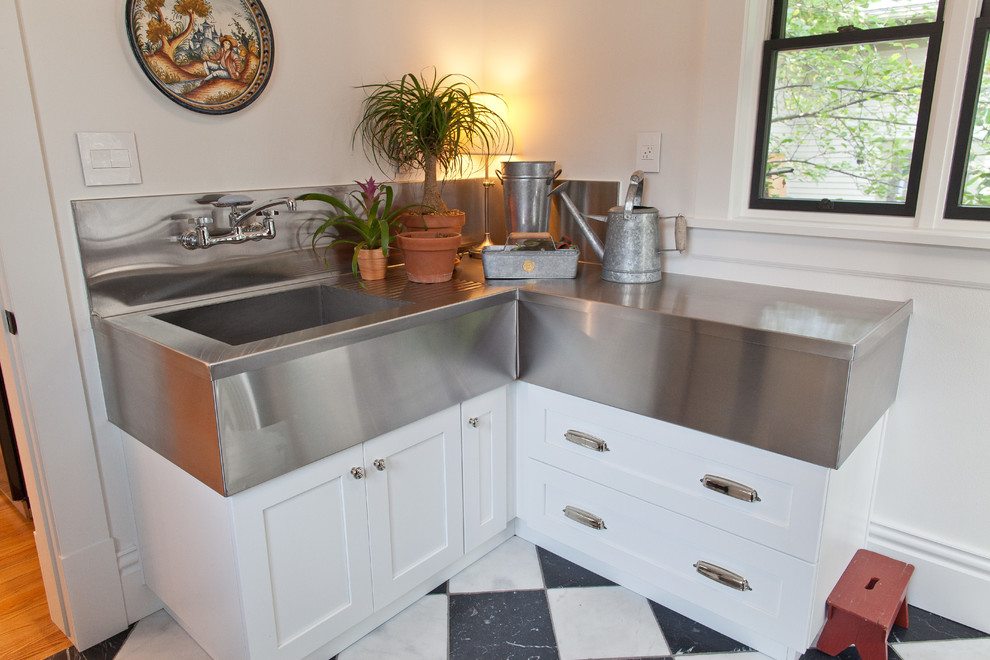 Inspiration for a small country l-shaped utility room in Other with an integrated sink, shaker cabinets, white cabinets, stainless steel benchtops, white walls, marble floors, multi-coloured floor and grey benchtop.