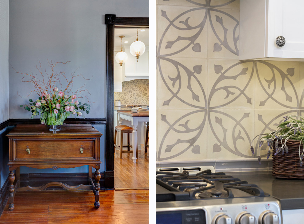 Inspiration for a mid-sized transitional galley medium tone wood floor enclosed kitchen remodel with a double-bowl sink, recessed-panel cabinets, white cabinets, quartz countertops, beige backsplash, ceramic backsplash, stainless steel appliances and a peninsula