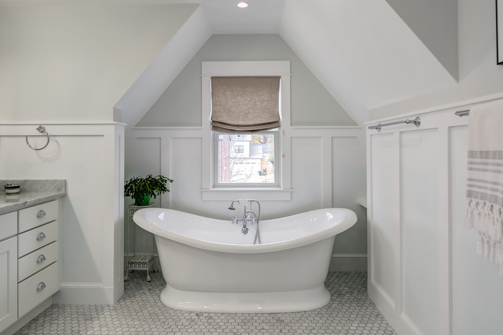 Mid-sized traditional master bathroom in Orange County with shaker cabinets, white cabinets, white walls, marble benchtops, a freestanding tub and mosaic tile floors.