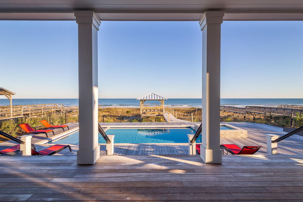 Design ideas for a beach style pool in Charleston with decking.