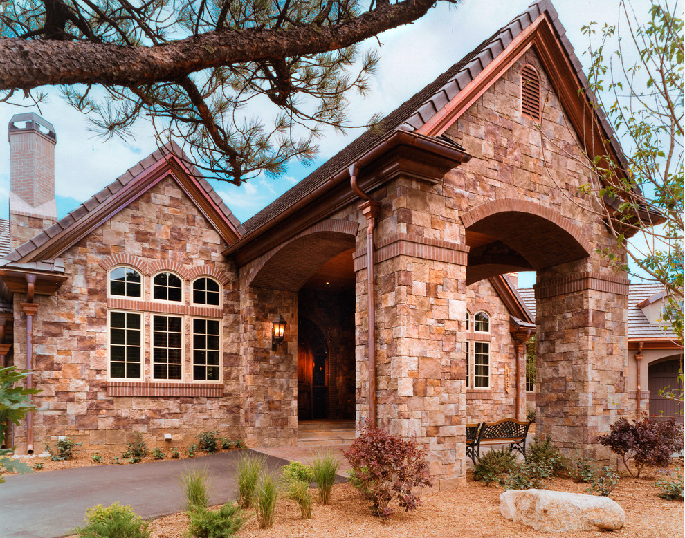 This is an example of a traditional exterior in Denver with stone veneer.