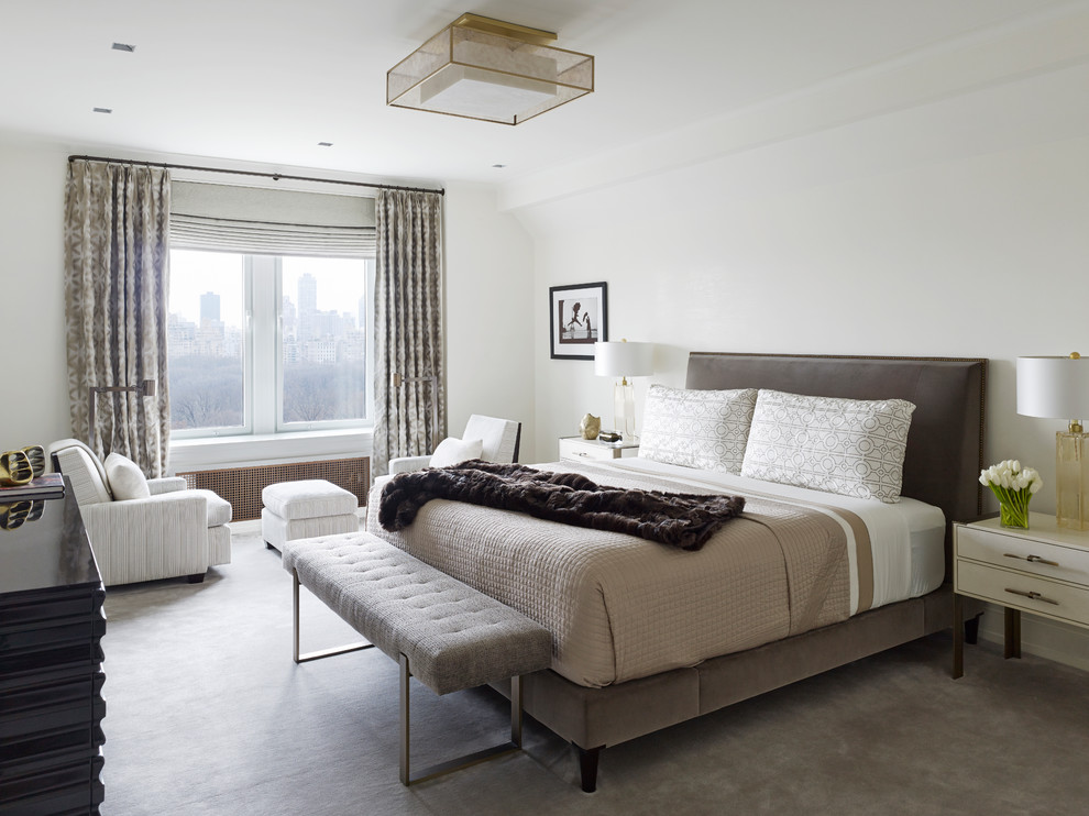 Contemporary master bedroom in New York with white walls, carpet, no fireplace and grey floor.