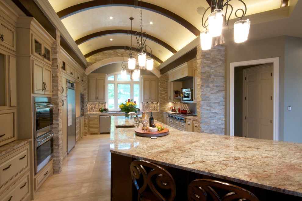 Photo of an expansive traditional u-shaped open plan kitchen in Austin with an undermount sink, raised-panel cabinets, distressed cabinets, granite benchtops, multi-coloured splashback, stainless steel appliances and travertine floors.