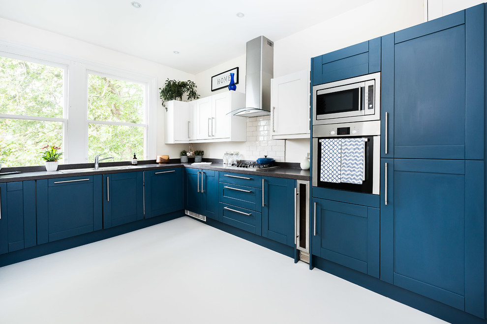 Photo of a mid-sized contemporary l-shaped separate kitchen in London with no island.