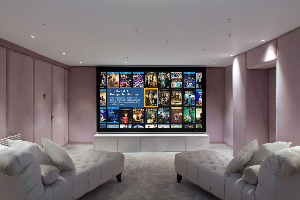 Photo of a small contemporary enclosed home theatre in London with pink walls, carpet and a projector screen.