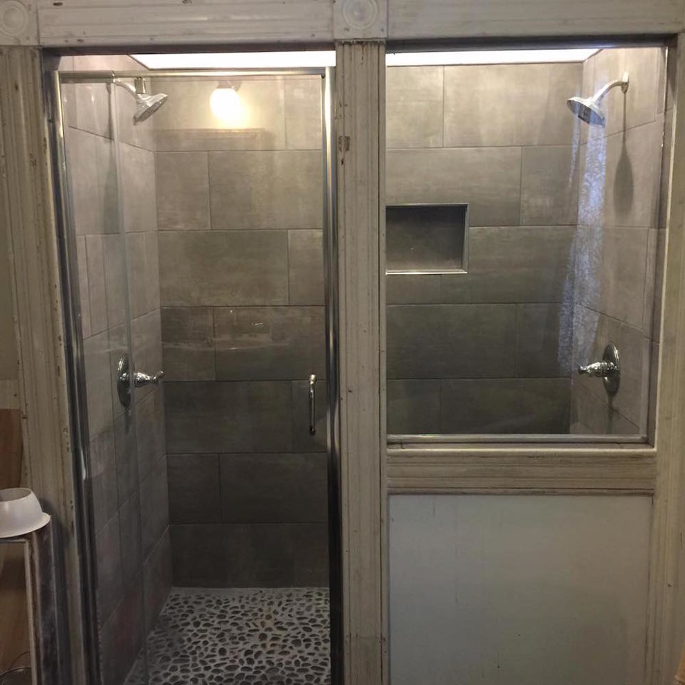 Mid-sized contemporary bathroom in Baltimore with an alcove shower, cement tile, beige walls, pebble tile floors and multi-coloured floor.
