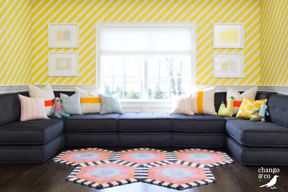 Inspiration for an expansive transitional gender-neutral kids' room in New York with yellow walls, dark hardwood floors and brown floor.