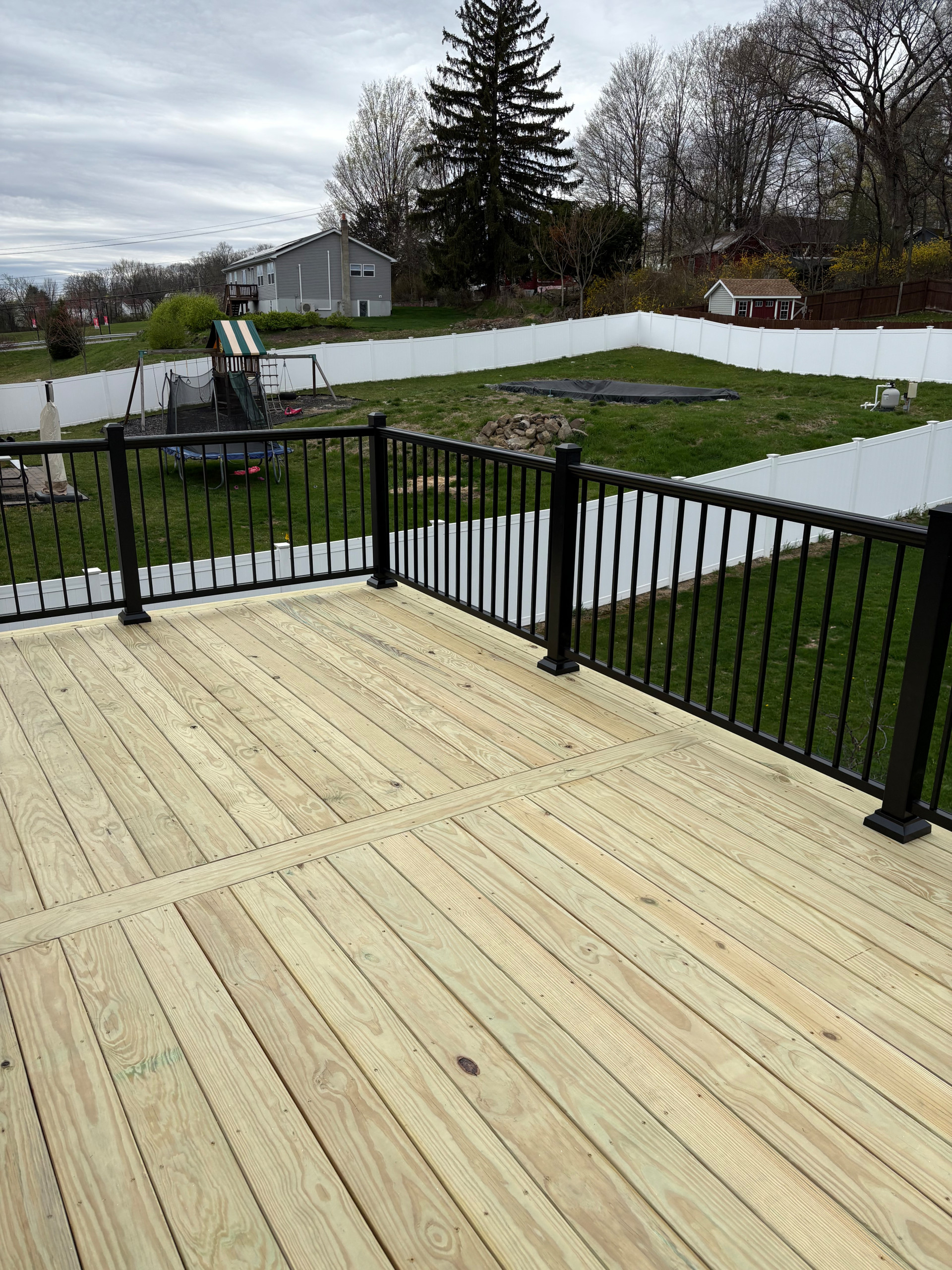 Pressure Treated Wood  Deck with black powder coated rail