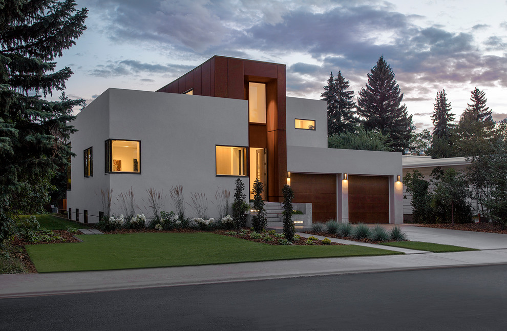 This is an example of a modern two-storey beige house exterior in Edmonton with a flat roof and mixed siding.