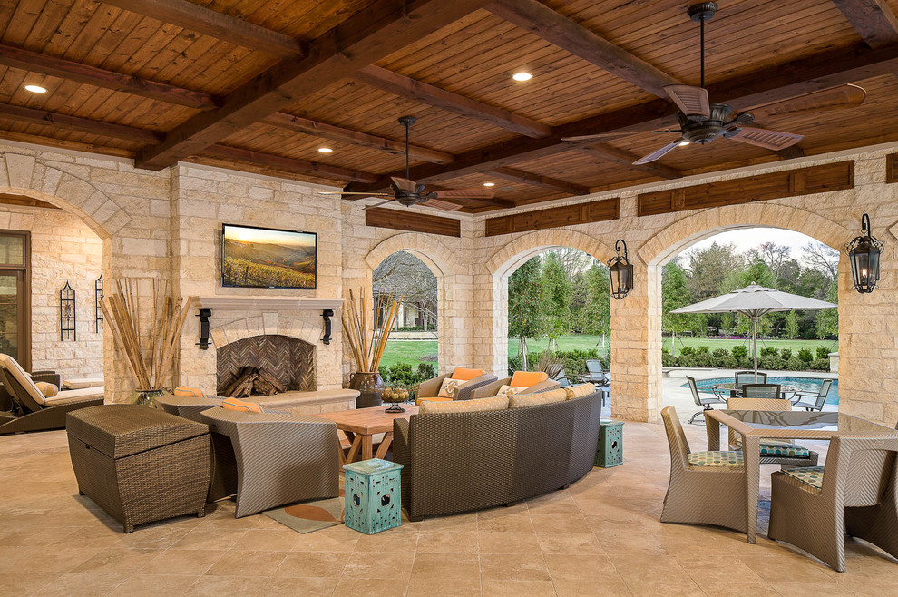 Design ideas for a traditional patio in Dallas with a fire feature and a roof extension.