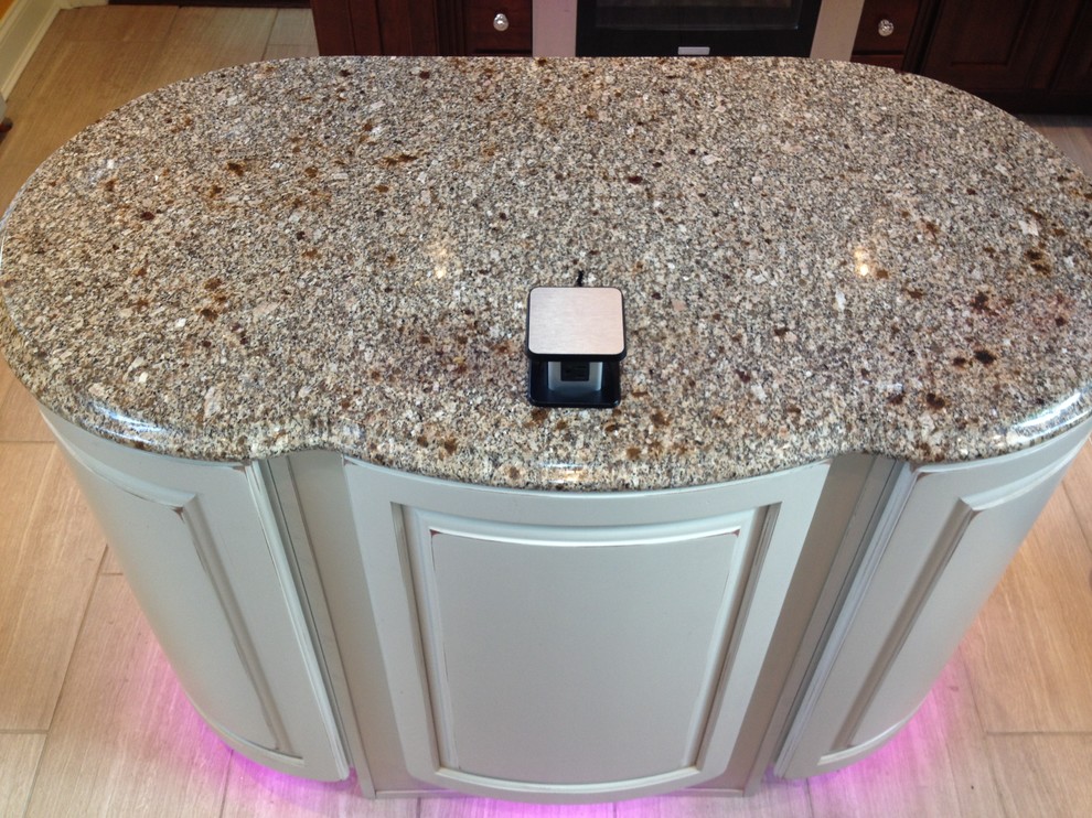 Home design - large transitional u-shaped porcelain tile home design idea in Newark with a farmhouse sink, recessed-panel cabinets, red cabinets, granite countertops, beige backsplash, mosaic tile backsplash, stainless steel appliances and an island