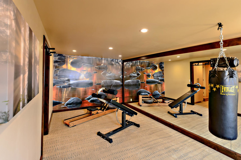 This is an example of a small transitional home weight room in San Diego with carpet, beige walls and beige floor.