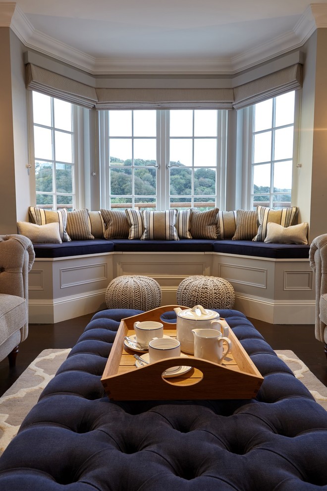 Photo of a medium sized contemporary open plan living room in Devon with beige walls, dark hardwood flooring, a standard fireplace, a stone fireplace surround and brown floors.