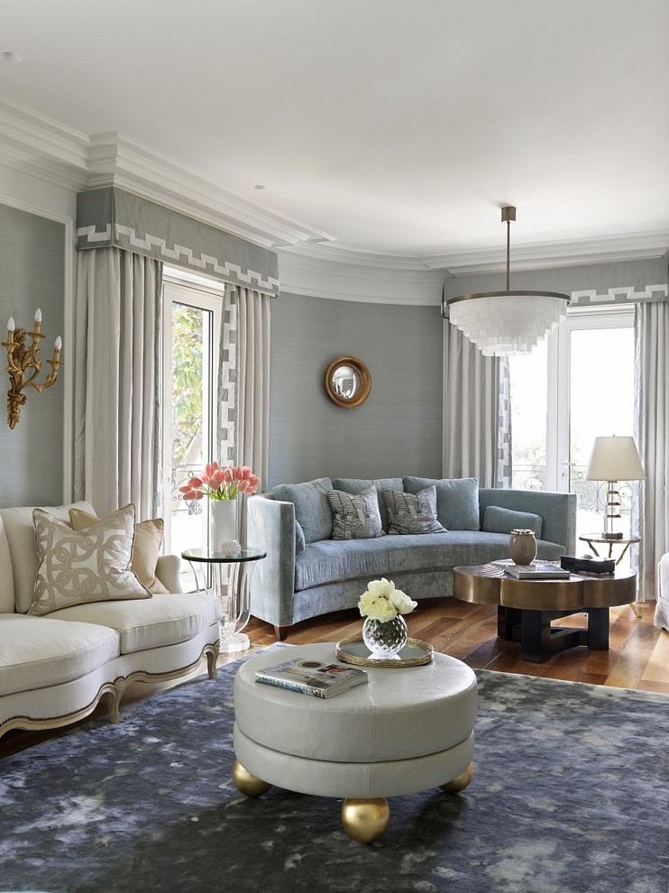 Inspiration for a transitional living room in Nice with grey walls, medium hardwood floors and brown floor.