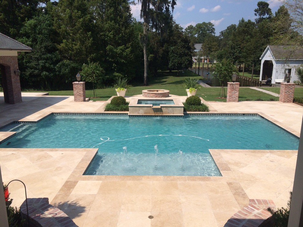 This is an example of a mid-sized contemporary backyard rectangular lap pool in New Orleans with a hot tub and tile.