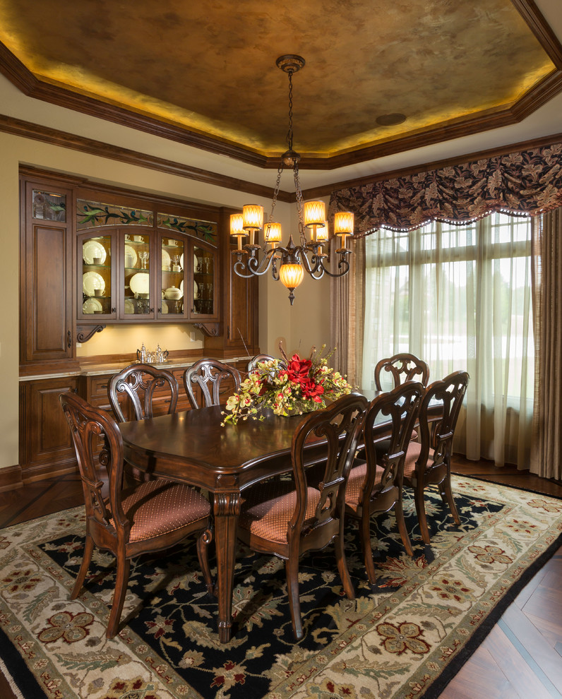 Photo of a traditional dining room in Milwaukee with beige walls and dark hardwood floors.