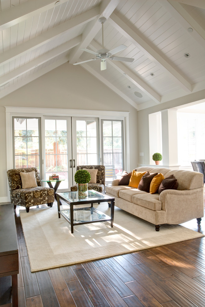 Inspiration for a traditional open concept family room in San Francisco with beige walls and dark hardwood floors.