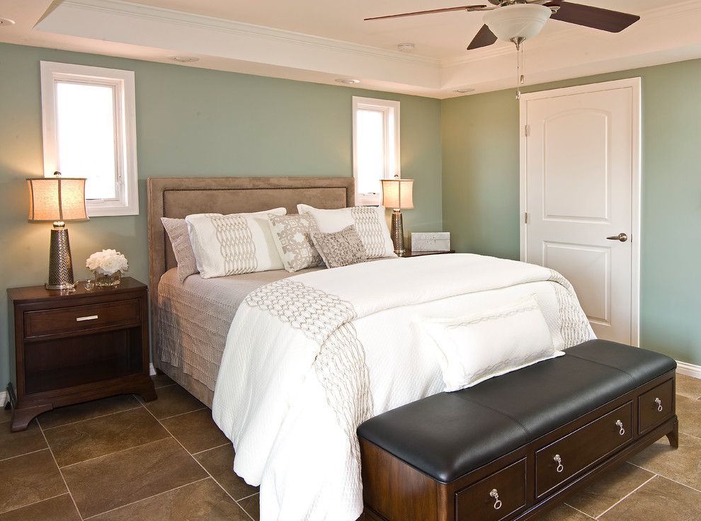 Small contemporary guest bedroom in Phoenix with green walls and ceramic floors.